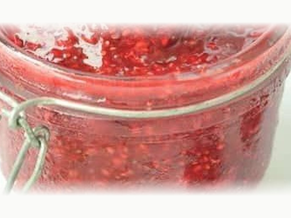 Easy chia jam made with raspberries in a glass jar