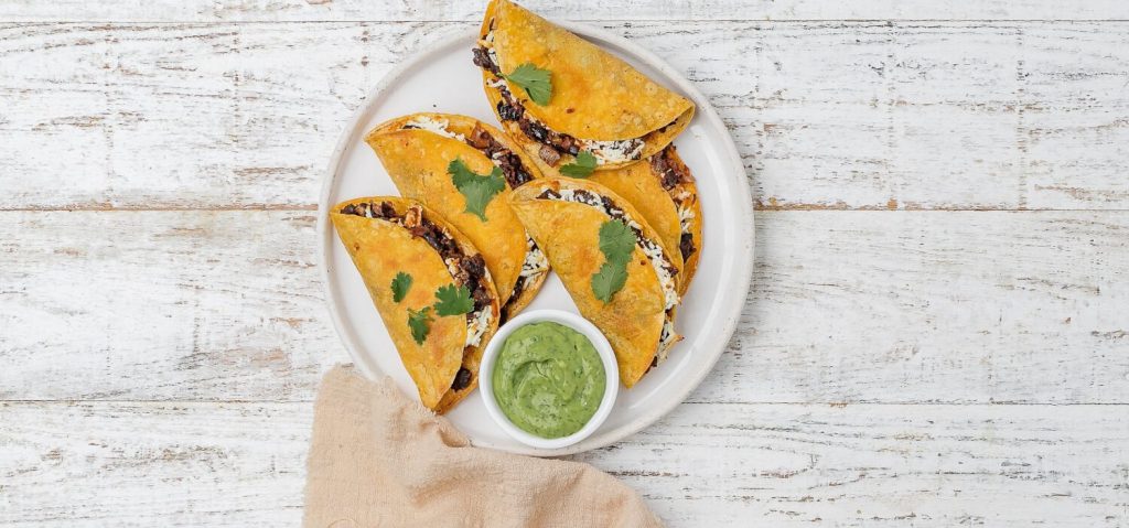 Crispy Black Bean Tacos with Avocado Coriander Sauce
