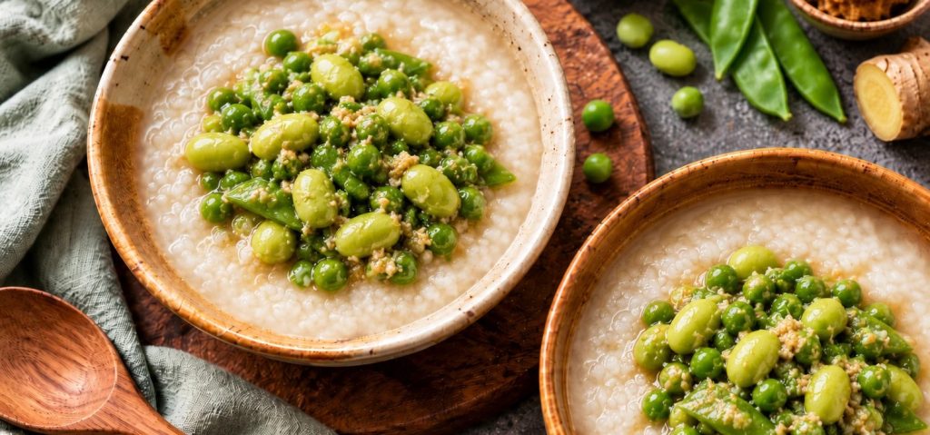 Peas and edamame miso congee in two bowls with snow peas and ginger